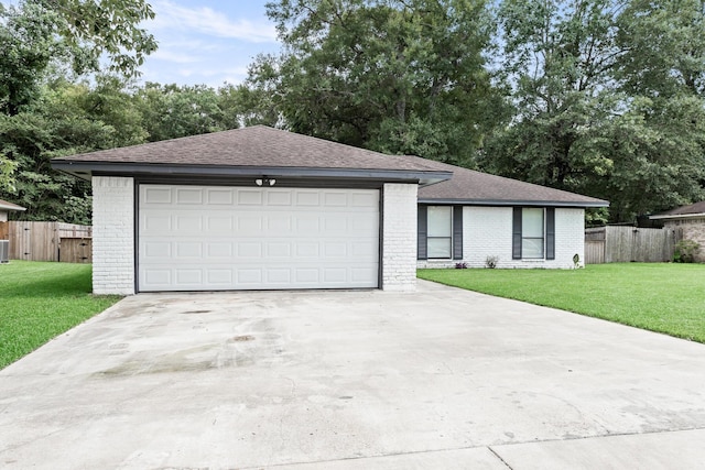 12795 Tanoak Ln, Beaumont, TX 77713 - single story home with brick siding, a garage, and roof with shingles