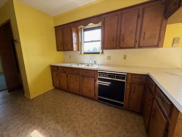 4390 Cartwright St, Beaumont, TX 77707 - kitchen with dishwasher, a sink, and light countertops