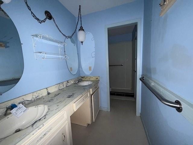 4390 Cartwright St, Beaumont, TX 77707 - full bathroom with double vanity, a shower, and concrete floors