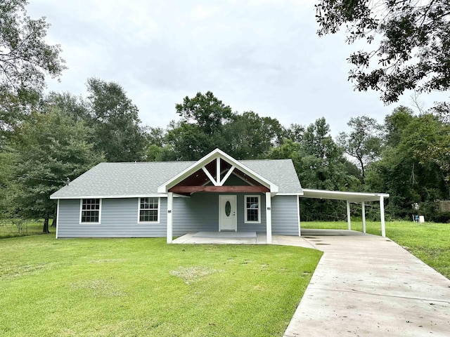 view of front facade with a carport and a front lawn