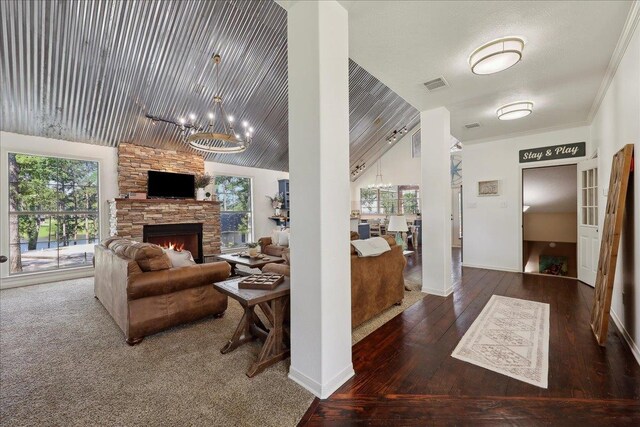 243 Riverbirch, Brookeland, TX 75931 - living area with a chandelier, plenty of natural light, wood-type flooring, a fireplace, and lofted ceiling