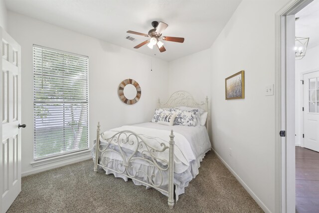243 Riverbirch, Brookeland, TX 75931 - carpeted bedroom featuring baseboards and a ceiling fan