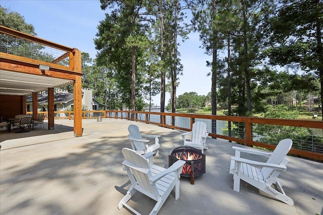 243 Riverbirch, Brookeland, TX 75931 - view of patio featuring an outdoor fire pit