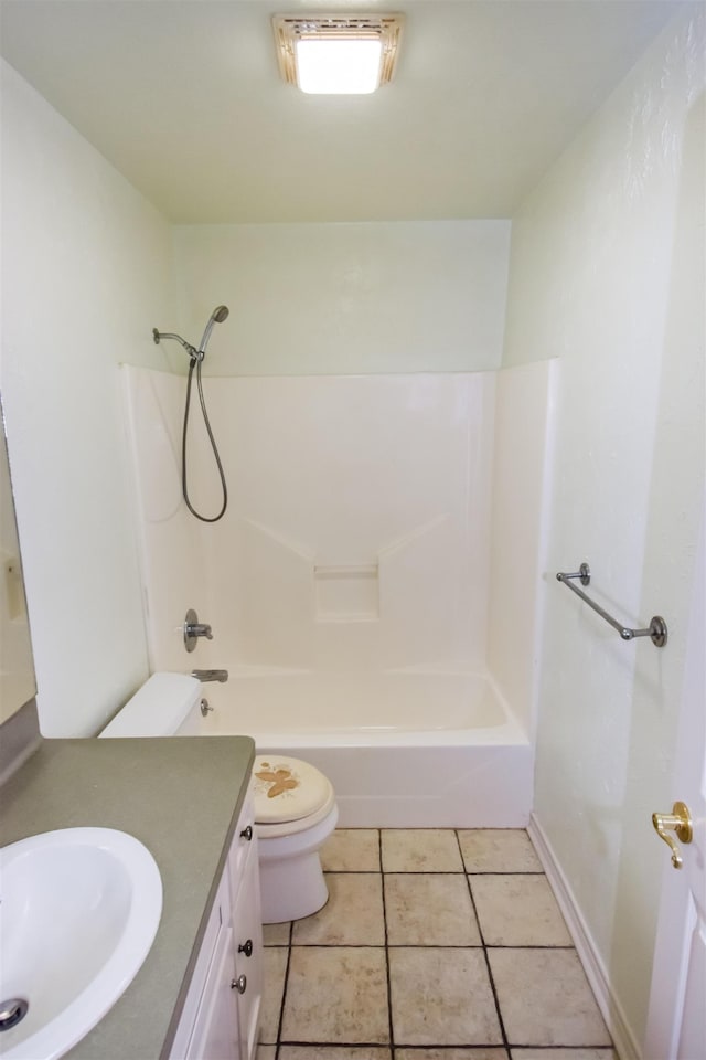 full bath with shower / washtub combination, toilet, vanity, baseboards, and tile patterned floors