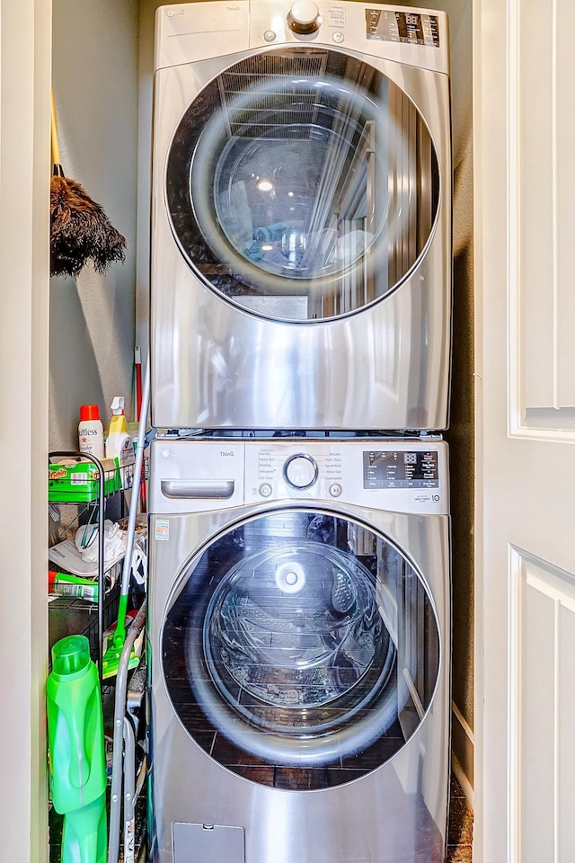 washroom featuring stacked washer and dryer