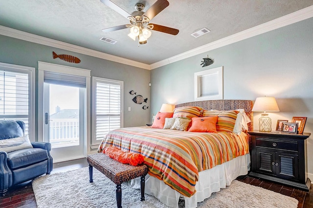 bedroom featuring dark hardwood / wood-style flooring, a textured ceiling, ceiling fan, and crown molding