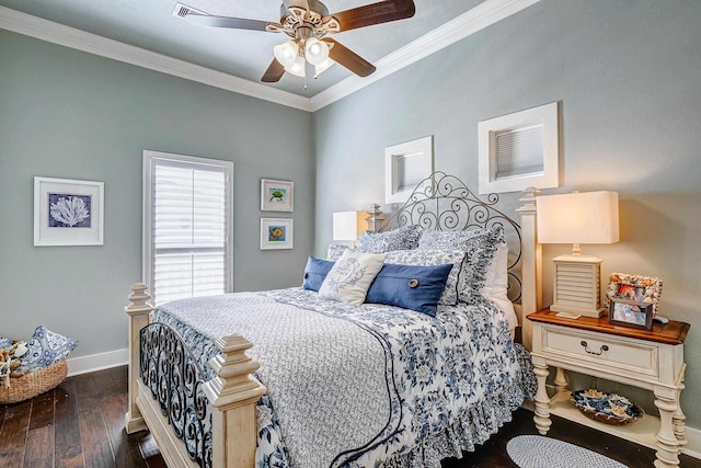 bedroom with dark hardwood / wood-style flooring, ceiling fan, and ornamental molding