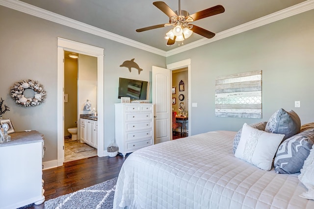 bedroom featuring ensuite bath, ceiling fan, dark wood-type flooring, and ornamental molding