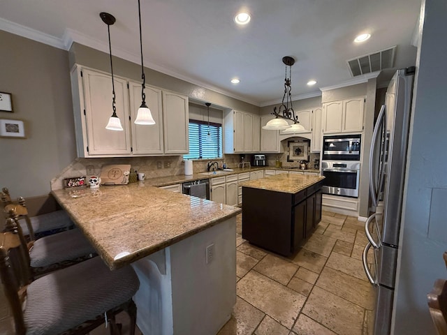 kitchen featuring a center island, decorative backsplash, decorative light fixtures, kitchen peninsula, and stainless steel appliances