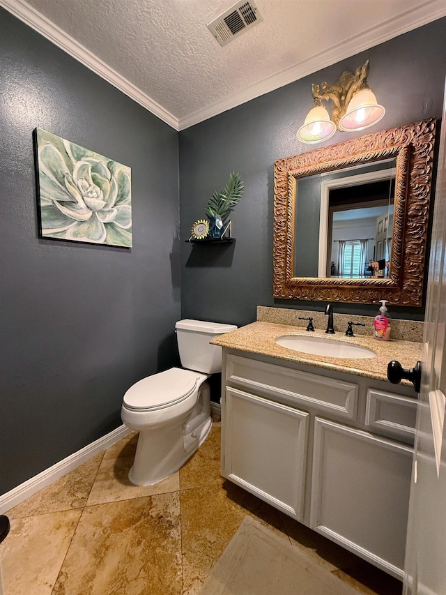 bathroom with crown molding, vanity, a textured ceiling, and toilet