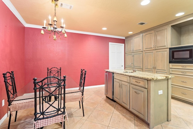 3590 Wheat Dr, Beaumont, TX 77706 - kitchen featuring black microwave, an island with sink, crown molding, a chandelier, and a textured wall