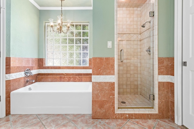 3590 Wheat Dr, Beaumont, TX 77706 - bathroom with a shower stall, a bath, a chandelier, tile patterned flooring, and crown molding
