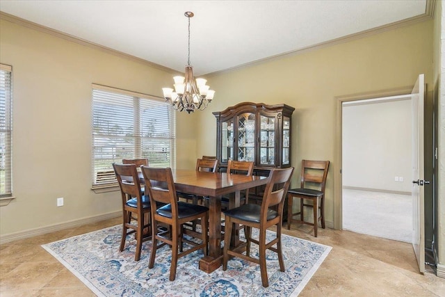 dining area featuring crown molding and a chandelier