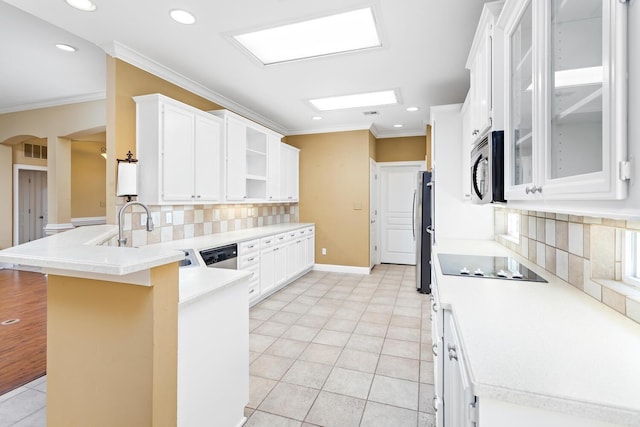 kitchen featuring white cabinetry, kitchen peninsula, and appliances with stainless steel finishes