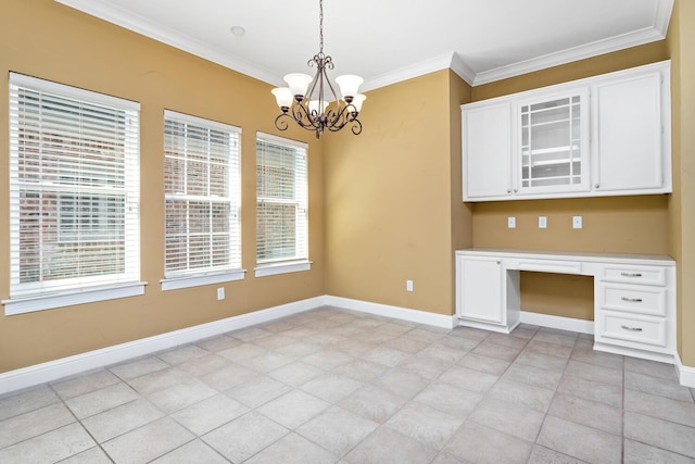 kitchen with white cabinets, pendant lighting, built in desk, and ornamental molding