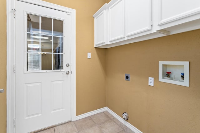 washroom with cabinets, washer hookup, electric dryer hookup, and light tile patterned flooring