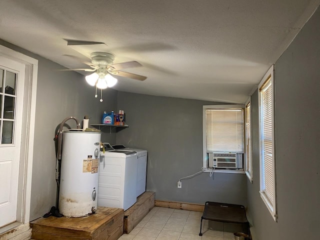 laundry area featuring water heater, a textured ceiling, cooling unit, laundry area, and independent washer and dryer