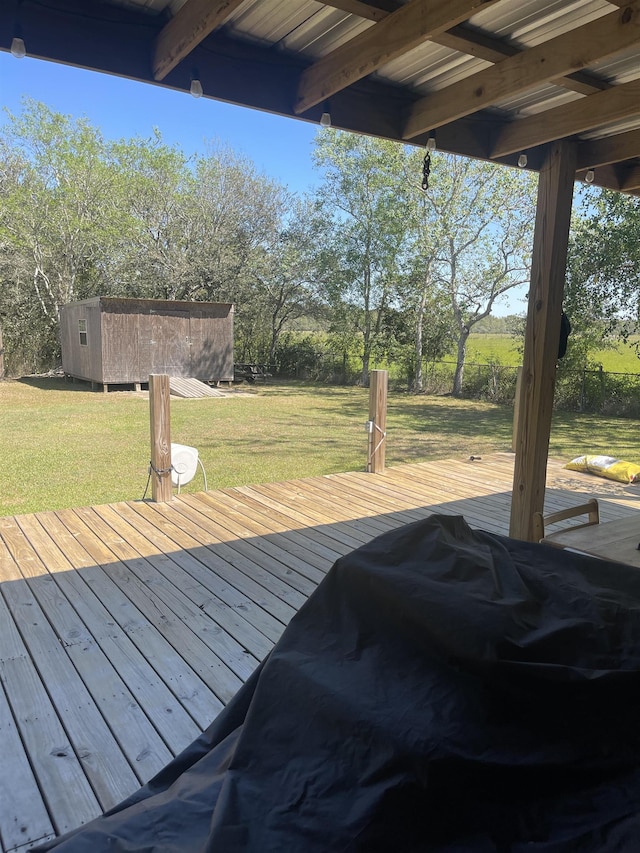 wooden deck featuring a yard