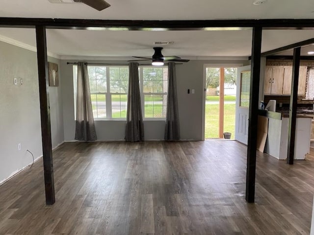 unfurnished living room with dark wood-style floors and a ceiling fan