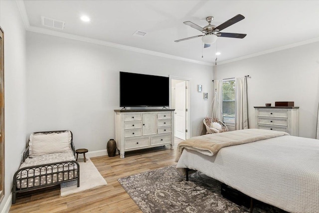 bedroom featuring light hardwood / wood-style floors, ceiling fan, and ornamental molding