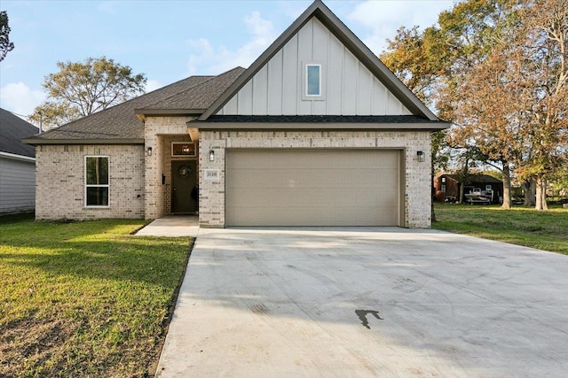 view of front of home featuring a garage and a front yard