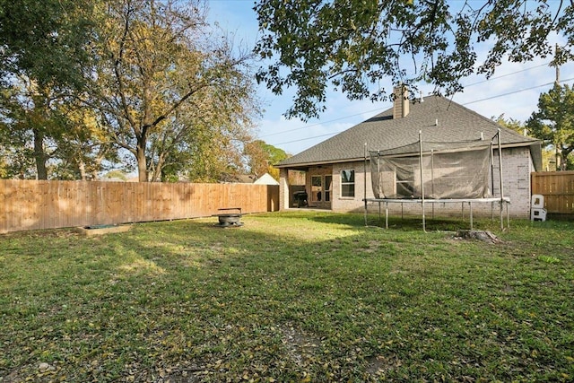 view of yard featuring a trampoline