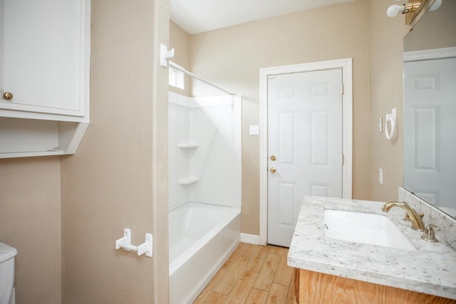 full bathroom with vanity, shower / bath combination, and toilet