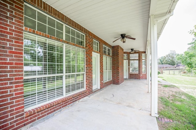 view of patio featuring ceiling fan