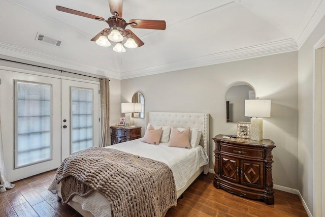 bedroom with wood finished floors, french doors, visible vents, and ornamental molding