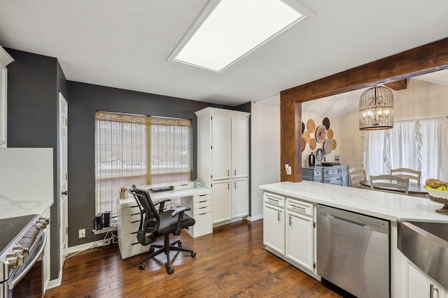 kitchen with white cabinets, dark wood-style flooring, a notable chandelier, light stone countertops, and appliances with stainless steel finishes