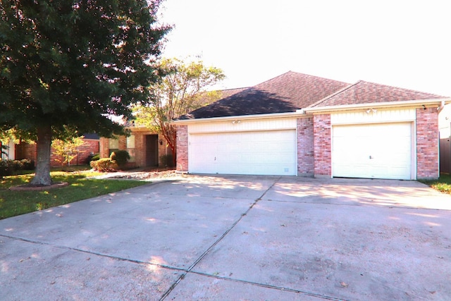 ranch-style home featuring a garage