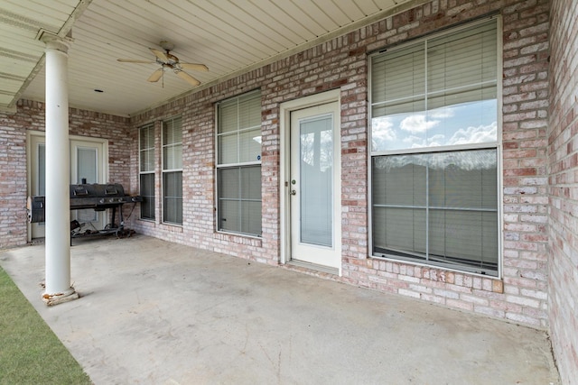 view of patio / terrace with area for grilling and ceiling fan