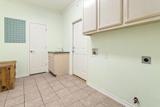 clothes washing area featuring crown molding, cabinets, light tile patterned floors, hookup for a washing machine, and hookup for an electric dryer