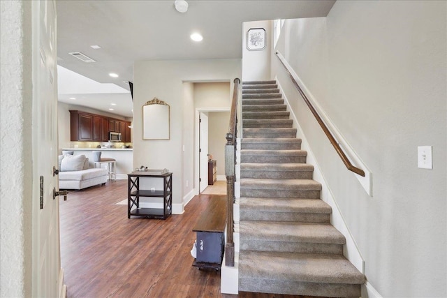 10375 Dominion Ct, Port Arthur, TX 77640 - stairway with wood finished floors, recessed lighting, and baseboards