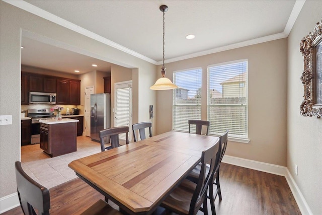 10375 Dominion Ct, Port Arthur, TX 77640 - dining space featuring crown molding, baseboards, light wood-type flooring, and recessed lighting
