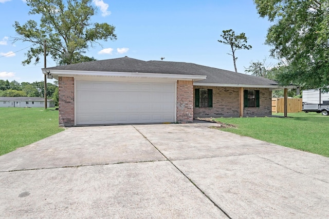 single story home featuring a front yard and a garage