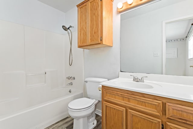 full bathroom with hardwood / wood-style floors, vanity, toilet, and bathing tub / shower combination