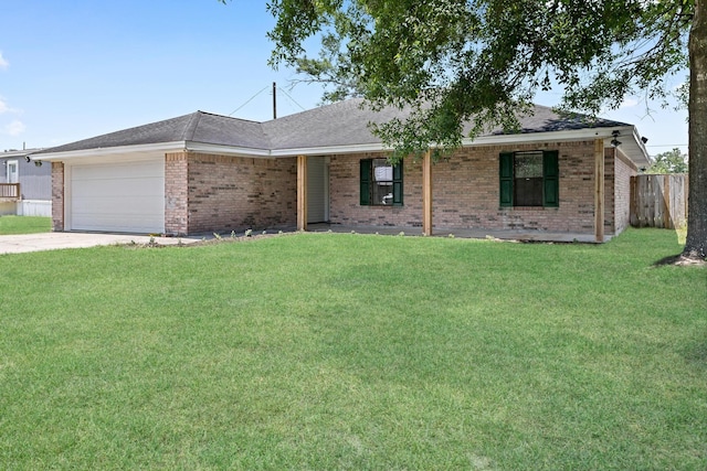 single story home with a front yard and a garage