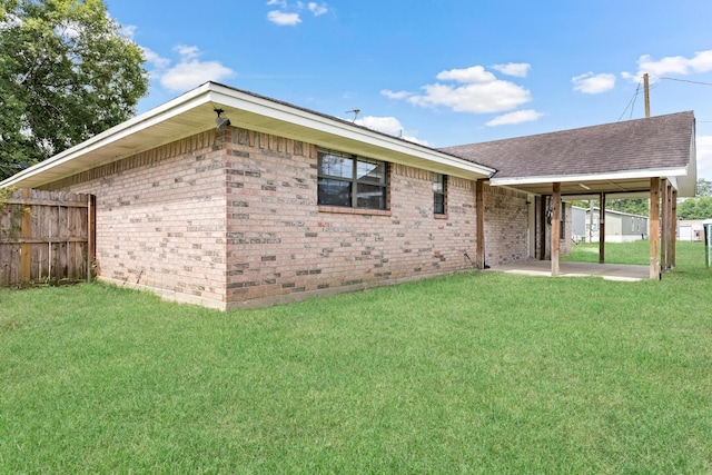 rear view of house with a patio area and a yard