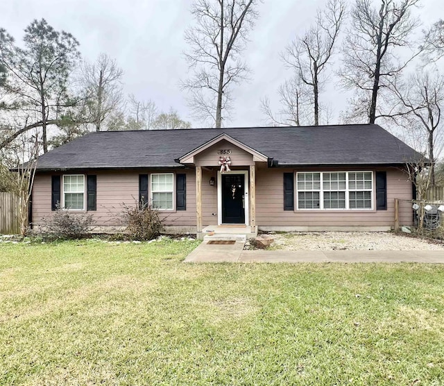 single story home featuring a front yard