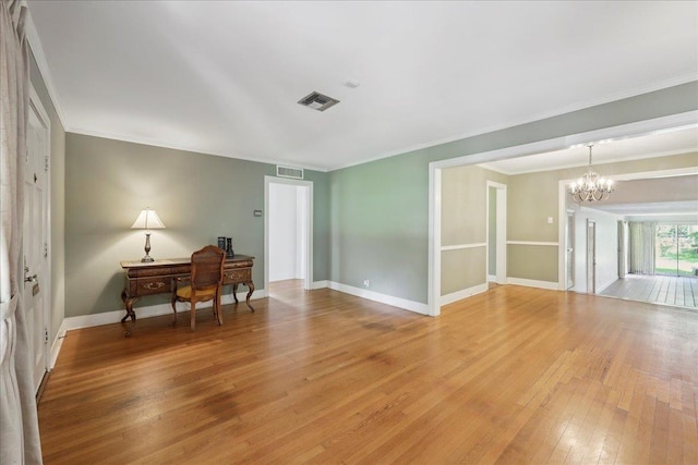 623 20th St, Beaumont, TX 77706 - spare room featuring light wood-style floors, a chandelier, ornamental molding, baseboards, and an office area