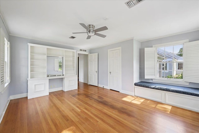 623 20th St, Beaumont, TX 77706 - unfurnished bedroom with baseboards, light wood-style flooring, ornamental molding, and a ceiling fan