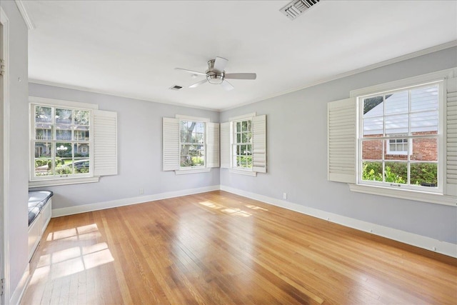 623 20th St, Beaumont, TX 77706 - empty room with light wood finished floors, ceiling fan, baseboards, and crown molding