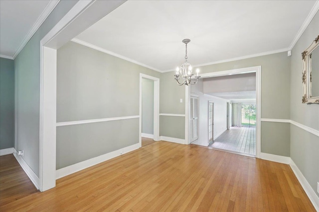 623 20th St, Beaumont, TX 77706 - unfurnished dining area with a chandelier, light wood-style flooring, baseboards, and crown molding
