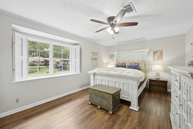 880 Goodhue Rd, Beaumont, TX 77706 - bedroom with dark wood-type flooring, crown molding, a textured ceiling, and ceiling fan