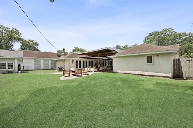 880 Goodhue Rd, Beaumont, TX 77706 - rear view of house featuring stucco siding, an outdoor living space, a patio area, and roof with shingles