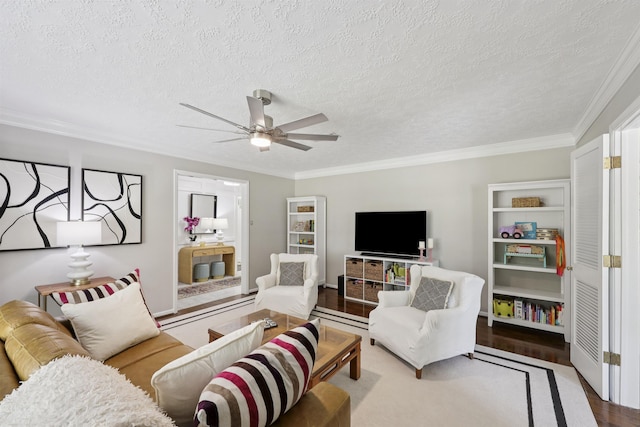 880 Goodhue Rd, Beaumont, TX 77706 - living room featuring wood finished floors, a ceiling fan, crown molding, and a textured ceiling