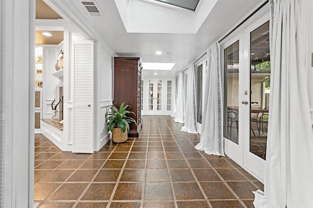 880 Goodhue Rd, Beaumont, TX 77706 - corridor with french doors, a skylight, and recessed lighting