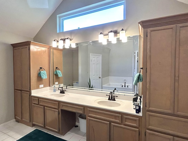 bathroom with tile patterned flooring, vanity, lofted ceiling, and a bath