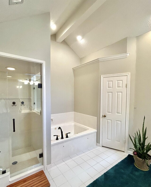 bathroom featuring tile patterned floors, vaulted ceiling with beams, and separate shower and tub